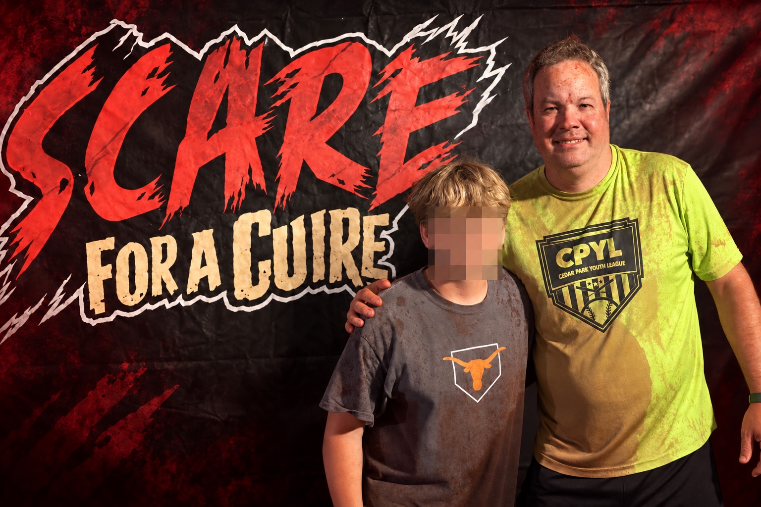 Mark and his son with the SCARE for a CURE logo; the child’s face is obscured for privacy